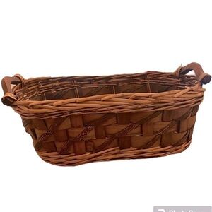 HANDWOVEN WICKER OBLONG CIRCULAR BASKET WITH HANDLES